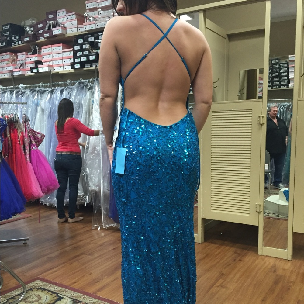 Blue backless beaded gown.